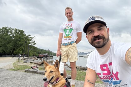 Paul Passavant and Matthew Conley with their pup, Sing Rae.